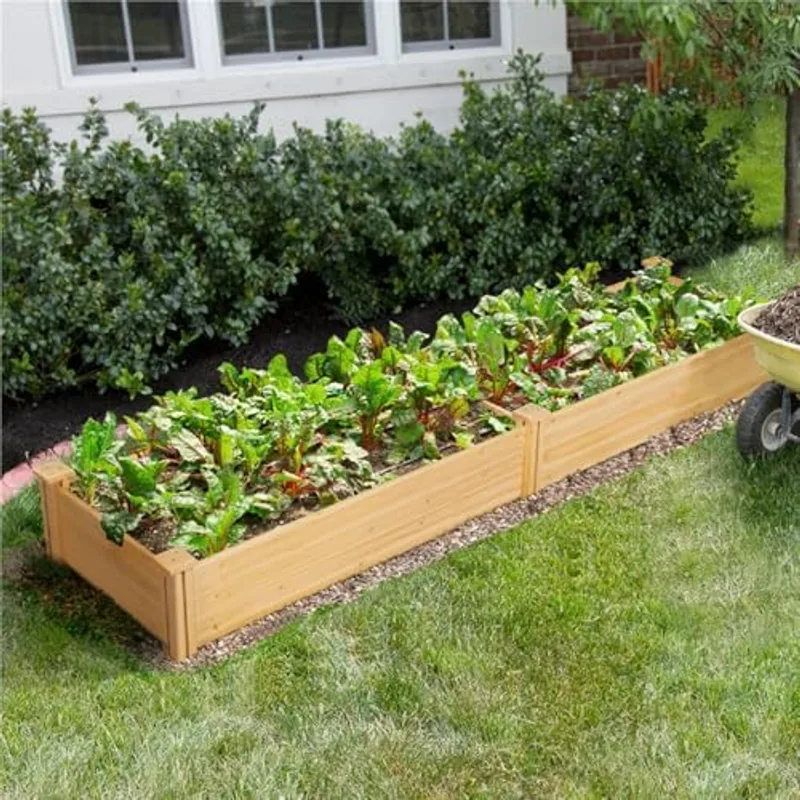Mesa de cultivo Yaheetech con lechugas, aromáticas y tomates en plena temporada de primavera
